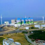 Power plant against a scenic background
